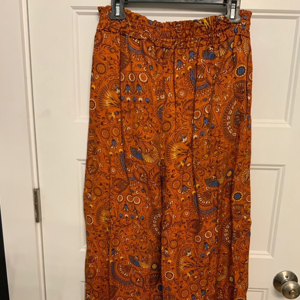 Pull on printed and flare Anthropologie pants.